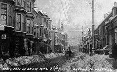 Heavy-fall-of-snow-in-Queens-Road-1909.-Pavements-and-roadway-cleared-unlike-today-when-it-snows